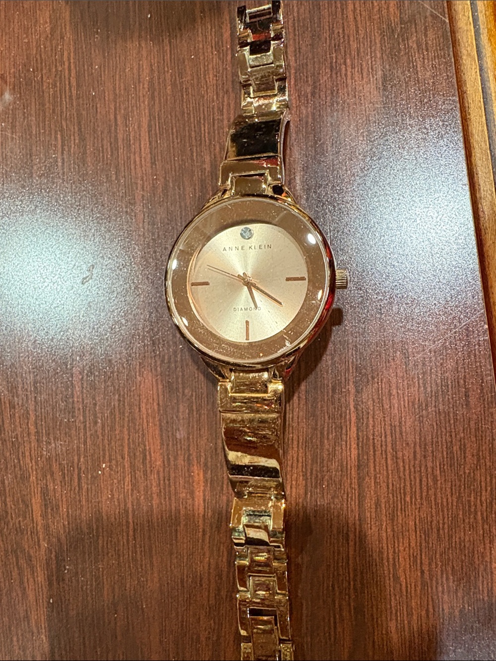 Anne Klein Gold Tone Bracelet Watch with Single Diamond Accent